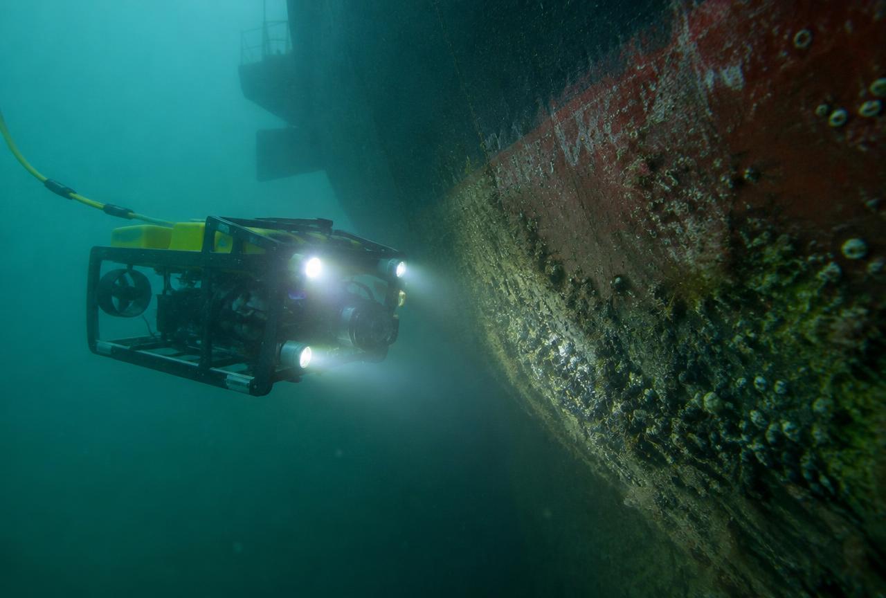 UUR surveying a cargo ship hull in a harbor